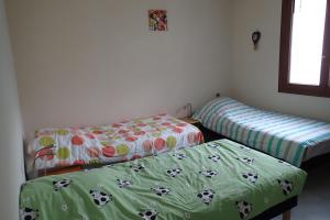 En eller flere senge i et værelse på églantine maison individuelle au coeur de loudenvielle