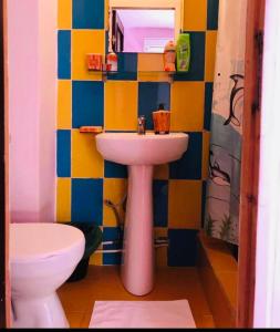 a bathroom with a sink and a toilet at Casa Ana in Bucharest +10 photos