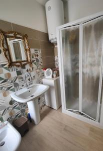 a bathroom with a shower and a sink and a toilet at Al Castello in Rocca Sinibalda +16 photos