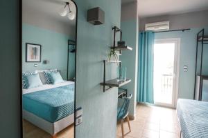 Postel nebo postele na pokoji v ubytování Joya Ofrynio Stylish Suites
