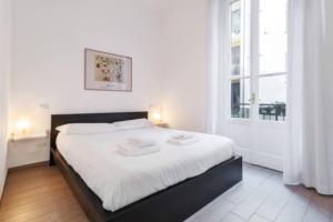 Posteľ alebo postele v izbe v ubytovaní Delizioso appartamento all Isola by Easylife