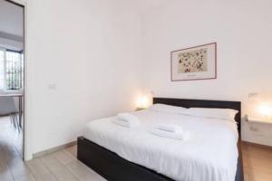Posteľ alebo postele v izbe v ubytovaní Delizioso appartamento all Isola by Easylife