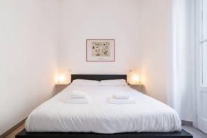 Posteľ alebo postele v izbe v ubytovaní Delizioso appartamento all Isola by Easylife
