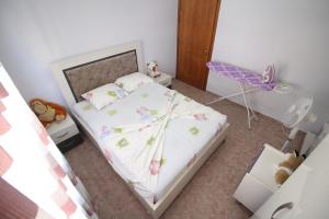 Postel nebo postele na pokoji v ubytování IRINA HOME