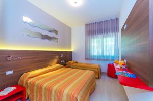 Кровать или кровати в номере Villaggio Mare Blu