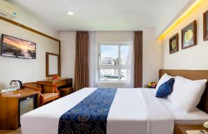 Postel nebo postele na pokoji v ubytování Saphia Hotel Nha Trang + 37 fotografií
