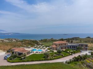an aerial view of a villa with a swimming pool at Tramonto Suites in Xi