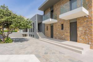a brick building with stairs on the side at Tramonto Suites in Xi