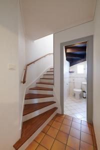 a staircase leading to a bathroom with a toilet at L'Autre Pavillon in Cholet