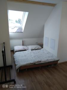 Wellness apartmán Beavital 객실 침대