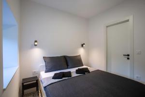 A bed or beds in a room at Premium Apartments Villa Ula,Free Private PARKING