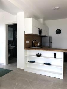 Kuchyňa alebo kuchynka v ubytovaní Apartments Amadea