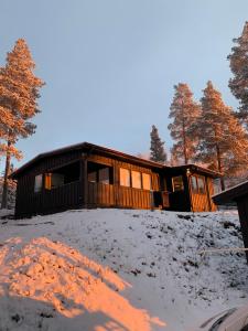 a house on top of a snow covered hill at 1125 Fjällstugan in Lofsdalen