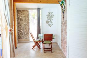 a room with two chairs and a window at Relax in Vieste