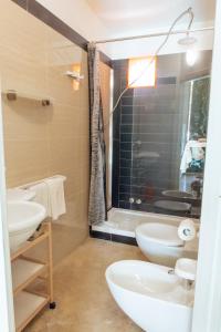 a bathroom with two sinks and a shower at Relax in Vieste
