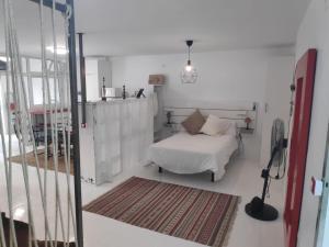 Cama o camas de una habitación en Loft Charco San Gines