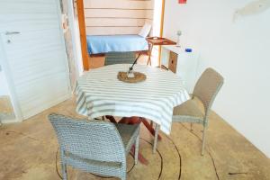 a room with a table and chairs and a bed at Relax in Vieste