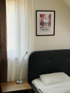 Postel nebo postele na pokoji v ubytování Apartmán JUH