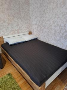 a mattress sitting on a bed in a room at Dobar san in Zagreb