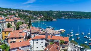 a view of a town with boats in the water at Premium Apartments Villa Ula,Free Private PARKING in Opatija