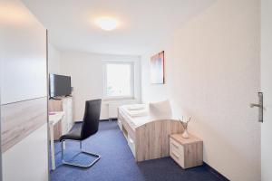 TV a/nebo společenská místnost v ubytování Landhotel Sonnenhof
