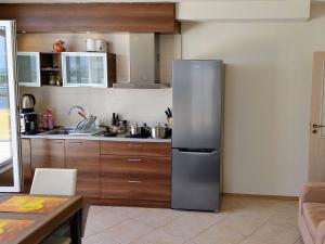 Kuchyň nebo kuchyňský kout v ubytování AKB Apartment Sea View