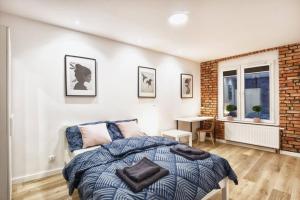 Posteľ alebo postele v izbe v ubytovaní Archirent Apartament Waryńskiego