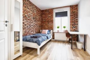 Posteľ alebo postele v izbe v ubytovaní Archirent Apartament Waryńskiego