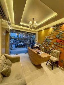 a living room with a couch and a wooden boat on the wall at Sugar Stars Inn in Varanasi