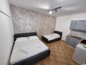 Letto o letti in una camera di Studio Vlora