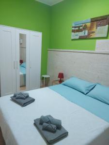 A bed or beds in a room at Casa dei filodendri