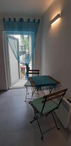 a room with two tables and a large window at Apartment Katrin im Zentrum in Bad Ischl