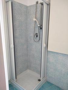 a shower with a glass door in a bathroom at A casa di Ro` in Agrigento +23 photos