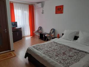 Postel nebo postele na pokoji v ubytování Vila Albatros