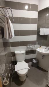 Koupelna v ubytování Agogo Downtown Hotel Surabaya