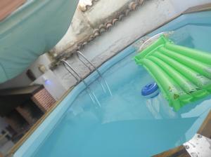 a pool of water with a green object in it at Casa Rural Abuela Andrea in Almonacid de Toledo