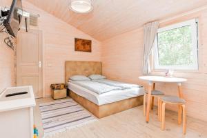 Säng eller sängar i ett rum på Laimingas Uodas