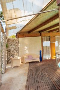a patio with a couch and a table and chairs at Relax in Vieste