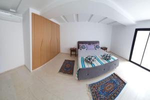 Postel nebo postele na pokoji v ubytování Appartement Corniche en bord de mer