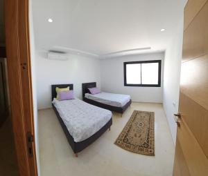 Postel nebo postele na pokoji v ubytování Appartement Corniche en bord de mer