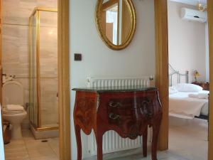 a bathroom with a dressing table and a mirror at Merlot Village Rental Apartments in Kariá
