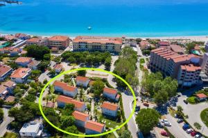an aerial view of a city with a yellow circle at Villas Corinthia in Baška