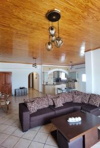 a living room with a couch and a table at GIALOS APARTMENT in Elafonisos