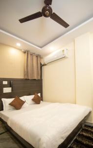 Ένα ή περισσότερα κρεβάτια σε δωμάτιο στο Hotel Siddharth A Boutique Guest House