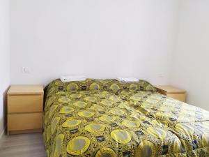 Giường trong phòng chung tại Levico Al Corso Apartments