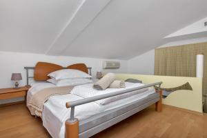 Posteľ alebo postele v izbe v ubytovaní Apartments Rita
