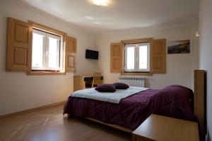 Ένα ή περισσότερα κρεβάτια σε δωμάτιο στο Casas do Mondego