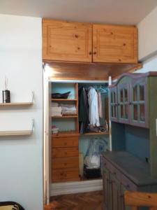 a room with a closet with a dresser and a drawer at Carlos Calvo in Buenos Aires