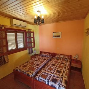 Postel nebo postele na pokoji v ubytování Sunrise Apartments