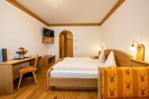 Postel nebo postele na pokoji v ubytování Hotel Christoph